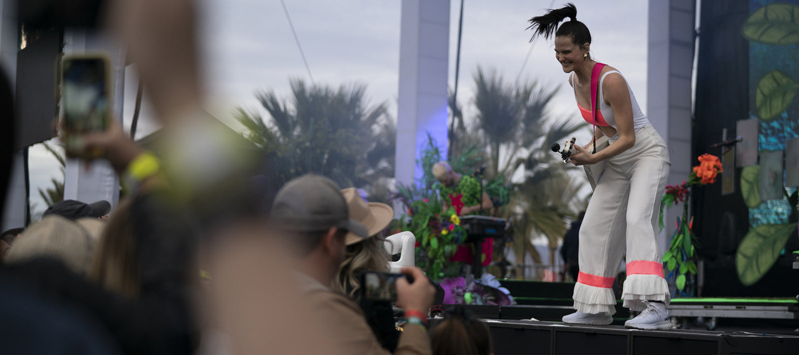 Top 5 Camping Friendly Music Festivals. Best Camping Music Festivals 2021. Singer on stage.